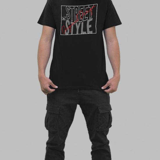 A young person wearing a black t-shirt with 'STREET STYLE' printed in bold red and white letters.
