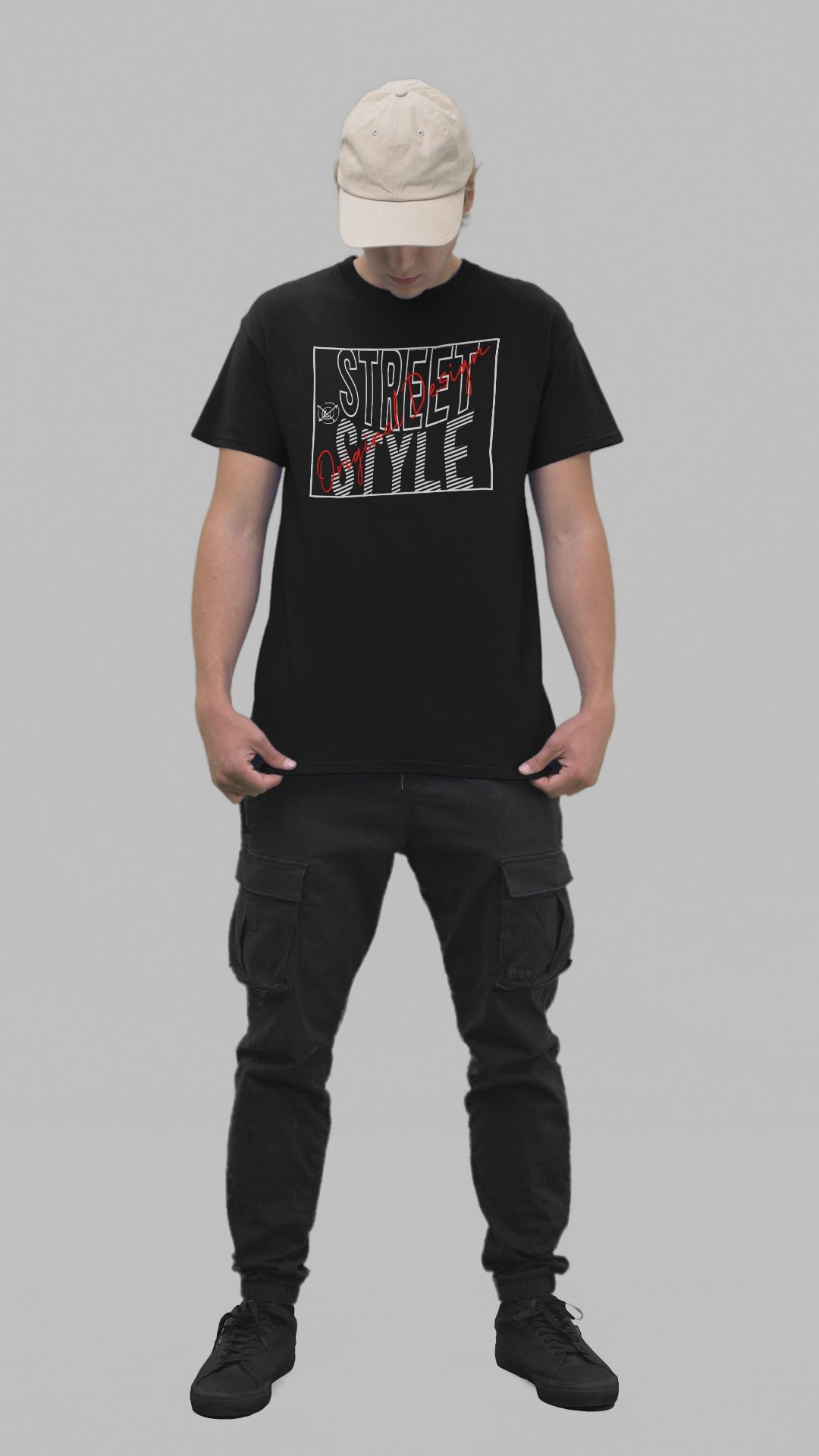 A young person wearing a black t-shirt with 'STREET STYLE' printed in bold red and white letters.